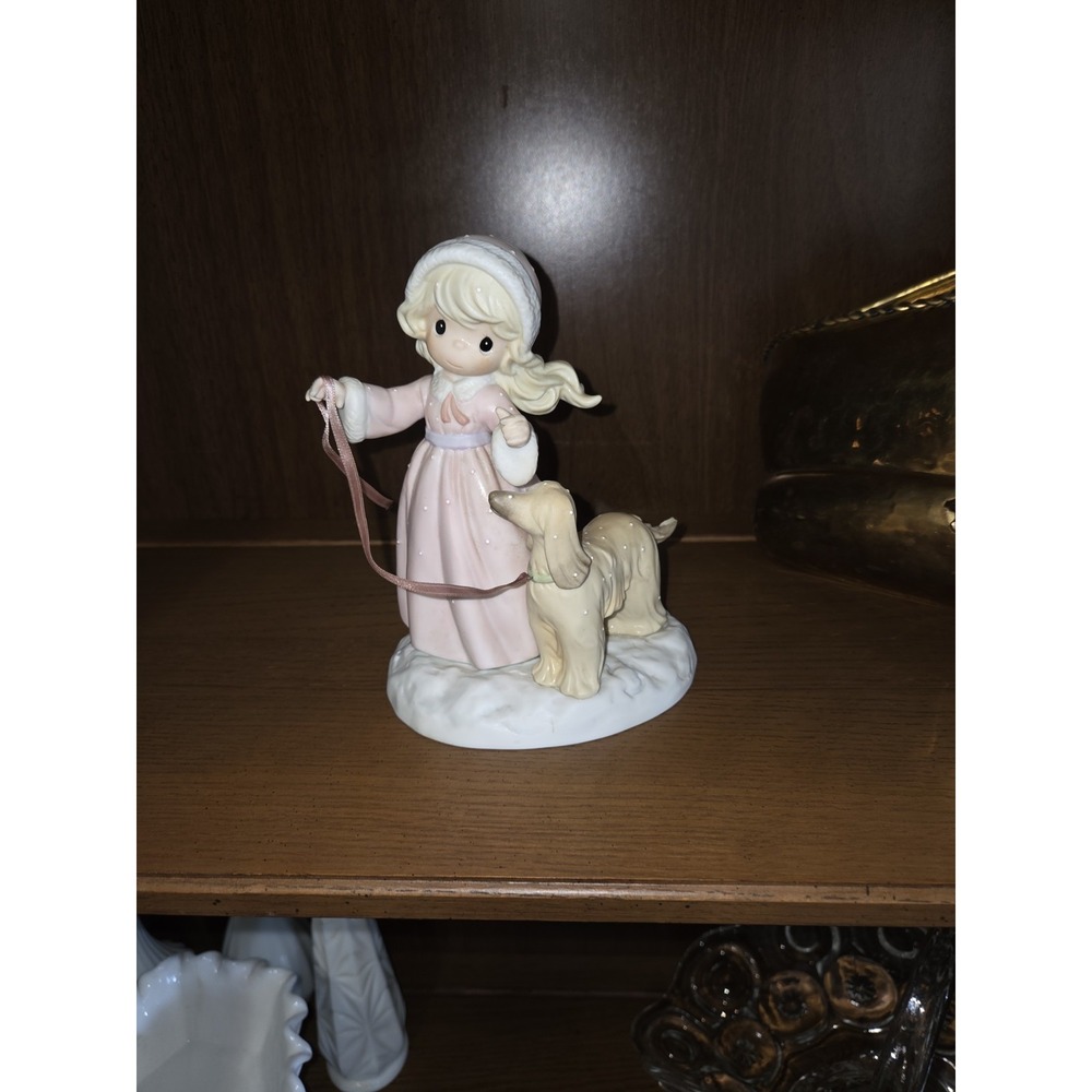 Precious Moments porcelain figurine titled "He Covers the Earth With His Glory"